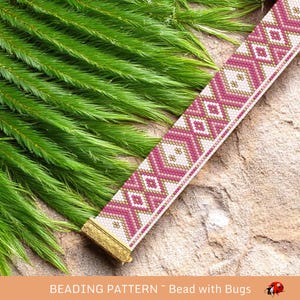 May include: A beaded bracelet with a geometric pattern in shades of pink, white, and gold. The bracelet has a gold clasp and is set against a backdrop of green foliage and a stone surface. The text "BEADING PATTERN ~ Bead with Bugs" is at the bottom.