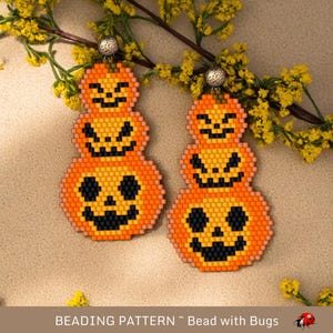 May include: A pair of beaded pumpkin earrings with orange, black, and white beads. The earrings are stacked with three pumpkins, each with a different facial expression.