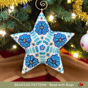 May include: A blue and white beaded star ornament with a gold hanger. The star is decorated with a repeating pattern of blue flowers.