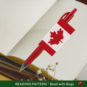 May include: A red pen with a beaded Canadian flag design. The flag features a red maple leaf on a white background, framed by red beads. The pen is resting on an open book. The text "BEADING PATTERN ~ Bead with Bugs" is at the bottom.