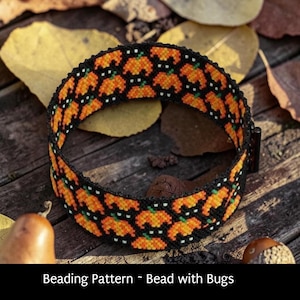 May include: A beaded bracelet with a repeating pattern of orange pumpkins on a black background. The bracelet is set against a rustic wooden surface with fallen leaves and the text "Beading Pattern ~ Bead with Bugs".