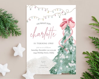 May include: A watercolor Christmas-themed invitation with a festive tree, pink bow, and string lights. The invitation reads "Oh What Fun Charlotte is Turning One!" with event details and RSVP information.