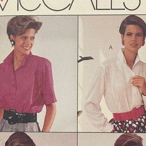 May include: A sewing pattern for a blouse with three different styles. The pattern is from McCall's and is part of the Woman's Day Collection. The pattern is for sizes D (12, 14, 16).