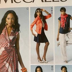 May include: Sewing pattern for a wrap dress, a blazer, and a skirt. The pattern is McCall's M6519 and is for sizes E5 (14-16-18-20-22).