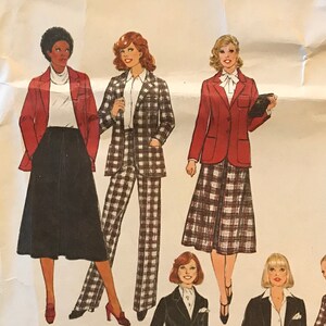 May include: Simplicity sewing pattern number 8865 for size 14 miss. The pattern includes five different outfits, featuring a red blazer, plaid pants, a black skirt, a plaid skirt, and a black pantsuit.