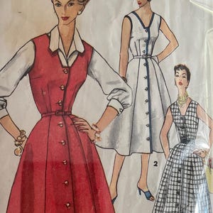 May include: Vintage Simplicity sewing pattern packet. The packet features illustrations of three different dresses. The main illustration shows a red dress with a white collared shirt underneath. The packet is sealed in clear plastic. The text on the packet reads "1094 Size 16 Bust 34".