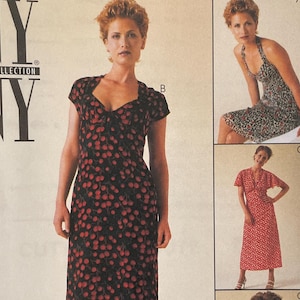 May include: McCall's NY collection sewing pattern 9338. The pattern features a woman modeling three different dress styles. The dresses are red with white polka dots and black with red cherry patterns. The pattern size is AX (4,6,8).