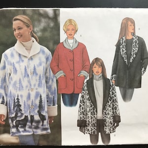 May include: A Butterick sewing pattern envelope 6774 for jackets in sizes 18, 20, 22. The cover displays illustrations of three jacket variations: one with a blue and white forest and wolf print, one in solid red, and one with a black and white leopard print.