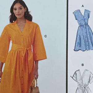 May include: McCall's sewing pattern M8477 featuring a woman in an orange button-down dress with a belt. The pattern includes multiple view options with simple instructions. Size Y5 (18-20-22-24-26). Designed and printed in the USA.