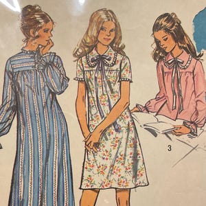 May include: Vintage sewing pattern for women's sleepwear. The pattern features illustrations of three different nightgown designs: a long blue striped gown, a floral print dress, and a pink nightgown. The pattern size is extra large, 38-40.