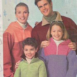 May include: McCall's sewing pattern M4676 featuring a family wearing fleece pullovers. The pattern includes illustrations of the pullover designs and the text "Easy McCall's" in red.