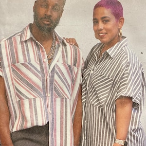 May include: Simplicity sewing pattern featuring two people wearing striped shirts. The pattern includes sizes XS-XXL and is designed and printed in the USA. The pattern is for a DIY & Lifestyle brand.
