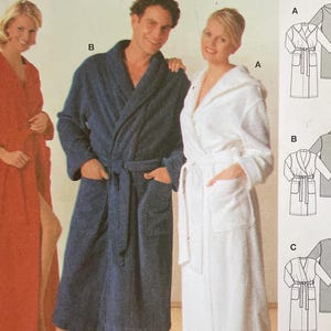May include: A sewing pattern package featuring three people wearing bathrobes. The package includes diagrams of the robe designs and the text "BATHING-GOWN" and "burda easy". The robes are in red, navy blue, and white.