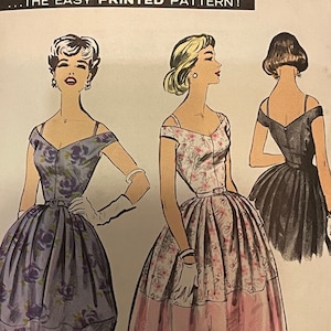 May include: Vintage sewing pattern for a dress with a full skirt. The pattern is from Advance, number 8676, size 14. The pattern shows three different views of the dress, one with a floral print, one with a pink and white floral print, and one with a solid black skirt.