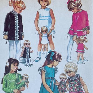 May include: Simplicity sewing pattern for a child's dress and coat. The pattern features illustrations of children's dresses in various styles, including a green polka-dot dress, a blue dress, and a pink dress. The pattern size is 4, with a breast size of 23 inches.