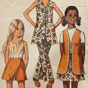 May include: Vintage Simplicity sewing pattern featuring three girls' outfits. The illustrations depict a wrap skirt, a vest with a floral print dress, and a floral print pantsuit. The pattern includes size 8, breast 27 inches, and waist 23 1/2 inches.