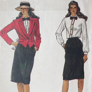 May include: Vogue Patterns sewing pattern envelope. The envelope features illustrations of two women wearing a red blazer and a white blouse with a black skirt. The text "Vogue Patterns" is at the top.