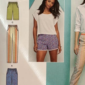 May include: Simplicity easy-to-sew pattern for shorts and trousers. The pattern shows different garment styles and prints. The pattern number is 1165 R5, with size information in U.S., Euro, and French sizes. The pattern is designed and printed in the USA.