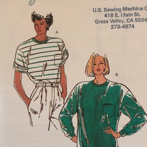 May include: A sewing pattern for a green long-sleeved shirt and a striped short-sleeved shirt. The pattern is from Kwik-Sew Pattern Co., Inc. and is a free sample.