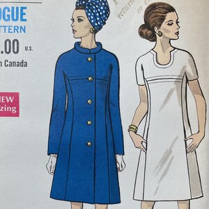 May include: Vintage Vogue sewing pattern featuring illustrations of two women in 1960s attire. The pattern includes a blue coat with gold buttons and a white dress. The pattern size is 14, with a 36-inch bust and 38-inch hip.