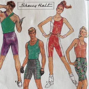 May include: A vintage Simplicity sewing pattern envelope featuring illustrations of athletic wear. The envelope includes the text "Simplicity", "Sherry Halt", and "Surf Club". The size is MD.