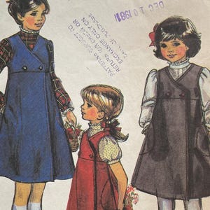 May include: Vintage McCall's sewing pattern featuring illustrations of young girls in dresses. The pattern cover displays the McCall's logo, the number 7725, and the date DEC 10 1981. The price is $2.00.