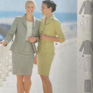 May include: A Burda sewing pattern package featuring two women modeling suit designs. The package includes illustrations of the suit styles, size charts, and text in multiple languages. The suits are a light gray and a light yellow.
