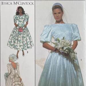 May include: Simplicity sewing pattern featuring a Jessica McClintock design. The pattern includes illustrations of wedding dresses, with a size 6 and EUR 34 sizing information. The pattern's front cover displays a bride in a light blue gown.