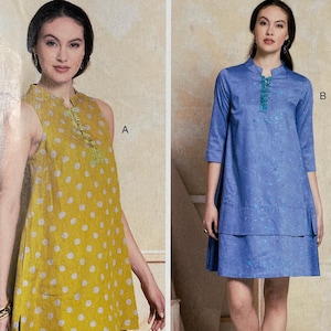May include: Vogue Patterns sewing pattern R10214 by Marci Tilton. The pattern features two tunic designs. One tunic is yellow with white polka dots, and the other is blue. The pattern size is LRG-XLG-XXL.