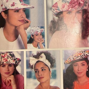 May include: A vintage Butterick sewing pattern titled "13 Great Hats." The cover features images of various hat styles, including baseball caps and brimmed hats, with floral and patterned designs. The pattern number is 5948.