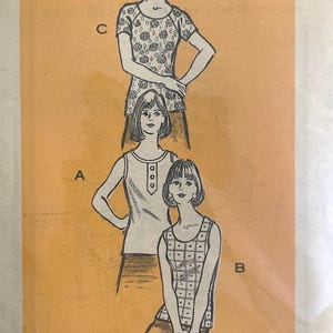 May include: Vintage sewing pattern in a plastic sleeve. The pattern features illustrations of three different tops. The pattern is printed on orange paper with the text "Printed Pattern" and the number "9399 - SIZE 16".