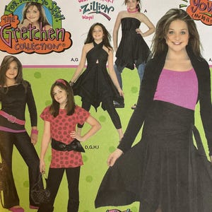 May include: Simplicity sewing pattern featuring the Gretchen Collection. The pattern includes various teen clothing designs, with the text "Wow! a whole WARDROBE for Teens To Sew!" and "wear the SKIRT Zillion Ways!" printed on the front.