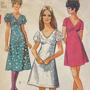 May include: Simplicity sewing pattern featuring three dress designs. The pattern includes a size 10 with a 32.5-inch bust. The dresses are illustrated in regular, midi, and mini lengths. The pattern is marked "New Sizing".
