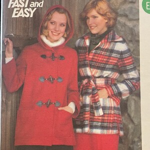 May include: Vintage Butterick sewing pattern featuring two women modeling outerwear. The pattern includes a red hooded toggle coat and a plaid jacket with matching pants. The text "FAST and EASY" is visible on the pattern.
