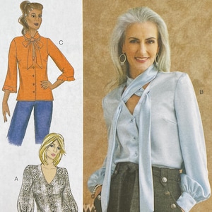 May include: A Butterick sewing pattern, B6710, featuring illustrations of women's blouses and tops. The pattern includes various styles, such as a blouse with a tie neck and a top with puffed sleeves. The pattern number and size range are visible.