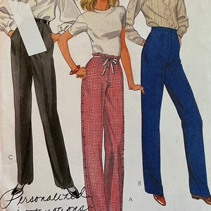 May include: McCall's sewing pattern number 8173 for trousers in sizes 14 and 38. The pattern includes instructions for a personalised fit. The image shows three women wearing different versions of the trousers: one in black, one in red and white plaid, and one in blue.