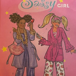 May include: A sewing pattern for a girl's robe and pajamas. The pattern is called "Sassy Girl" and is for sizes 7-8, 10, and 12. The pattern includes a pink robe with a tie belt and a pair of pajamas with a lip print.