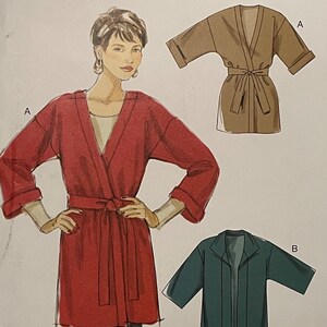May include: A sewing pattern for a long-sleeved robe with a tie belt. The pattern is for sizes X-Small to X-Large. The pattern is called "stitch 'n save" by McCall's and has the number M6490.