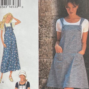 May include: A sewing pattern envelope labeled Style 2569 featuring illustrations and a photograph of a pinafore dress. The pattern includes options for a long floral dress, a short white dress, and a short blue polka dot dress with two front pockets.