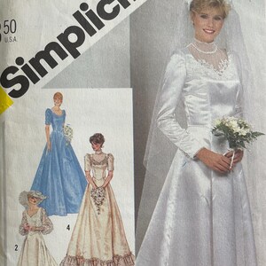 May include: Simplicity sewing pattern for a wedding dress, size 12 Miss. The cover features a woman in a white satin gown with long sleeves, lace details, and a veil. Additional dress styles are shown in smaller images.
