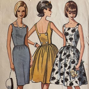 May include: A vintage McCall's sewing pattern for a dress with a slim or full skirt. The pattern number is 7248 and the size is 30-31 bust. The pattern is printed on a white background with a blue circle at the bottom.