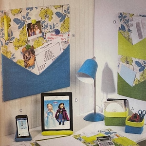 May include: A sewing pattern for a home decor project. The pattern includes instructions for making a desk organizer with pockets, a lamp, and a pencil holder. The pattern is called McCall's Home Decorating M7139 and is for size OSZ.