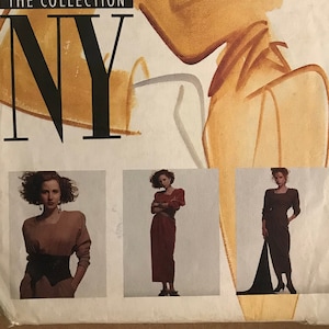 May include: A sewing pattern envelope with a black and white illustration of a woman wearing a dress. The envelope is labeled "McCall's NY The Collection" and has a size 8 pattern for a dress. The pattern is for a dress with a long skirt and a fitted bodice.