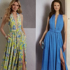 May include: Vogue Patterns sewing pattern featuring two dresses. One dress is a long, flowing design with a floral print, and the other is a knee-length solid blue dress. Both dresses have a halter neckline and a high slit.