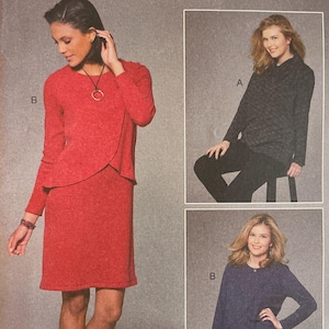 May include: A McCall's sewing pattern, M7655, featuring three different dress designs. The pattern includes sizes 18W-24W. The cover shows images of the finished garments, including a red dress, a black top and pants, and a blue dress.