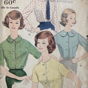 May include: Vintage Vogue printed pattern envelope featuring illustrations of young women's fashions. The envelope is tan with text and illustrations in black, blue, green, and yellow. The price is 60c.