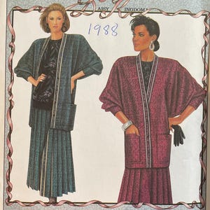 May include: A Simplicity sewing pattern envelope, number 9414, featuring a Daisy Kingdom design from 1988. The illustration shows two outfits consisting of long-sleeved jackets with front pockets and pleated skirts, displayed in teal and magenta colorways.