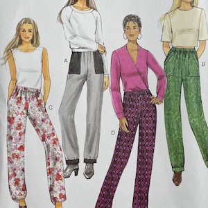 May include: A Butterick sewing pattern, B6137, showing illustrations of four different outfits. The pattern includes various trousers and tops. The cover has the text "FAST & EASY" and the size range is (14-16-18-20-22).