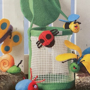 May include: A sewing pattern for making soft toys. The pattern includes instructions for making a ladybug, a butterfly, a snail, a bee, and a spider. The pattern is called "B4478 Butterick" and is for "Soft Stuff".