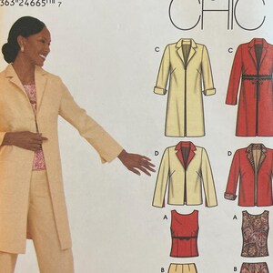 May include: Simplicity Easy Chic sewing pattern. The pattern features a woman wearing a light tan suit. The pattern includes illustrations of various jacket and trousers combinations. The pattern number is 9577.